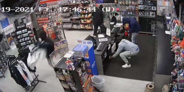 Suspects are seen looting a store in Chicago's Chatham neighborhood on Friday night. (Chicago Police)