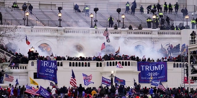 In this Jan. 6, 2021, file photo, violent protesters, loyal to President Donald Trump, storm the Capitol in Washington. 