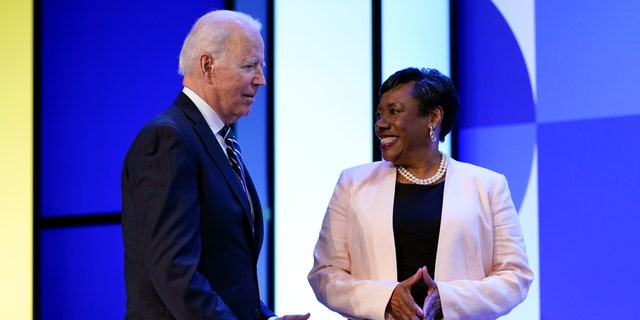 President Biden speaks with National Education Association President Becky Pringle at the NEA's annual meeting at the Walter E. Washington Convention Center in Washington, Friday, July 2, 2021. (AP Photo/Patrick Semansky)