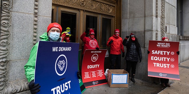 Chicago Teachers Union leadership list their demands and leave a box of coal outside the entrance of City Hall on January 4th, 2021. (Photo by Max Herman/NurPhoto via Getty Images)