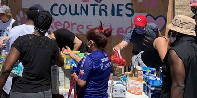 Volunteers give out food and essentials in Minneapolis in July 2020.