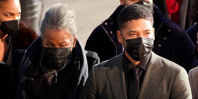 Actor Jussie Smollett arrives with his mother Janet, Tuesday, Nov. 30, 2021, at the Leighton Criminal Courthouse for day two of his trial in Chicago.