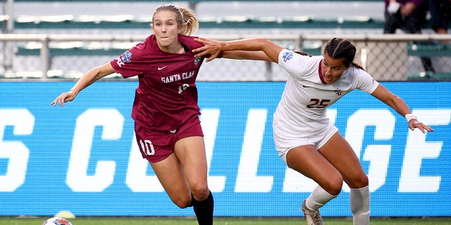 Kelsey Turnbow (10) of the Santa Clara Broncos battles Emily Madril (25) of the Florida State Seminoles for the ball during the Division I Women's Soccer Championship at Sahlens Stadium at Wakemed Soccer Park May 17, 2021 in Cary, North Carolina.