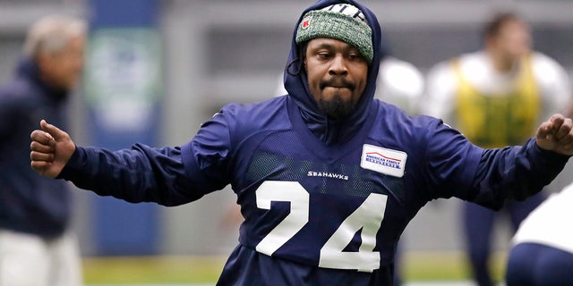 Seattle Seahawks running back Marshawn Lynch warms up at the NFL football team's practice facility Tuesday, Dec. 24, 2019, in Renton, Wash. When Lynch played his last game for the Seahawks in 2016, the idea of him ever wearing a Seahawks uniform again seemed preposterous. Yet, here are the Seahawks getting ready to have Lynch potentially play a major role Sunday against San Francisco with the NFC West title on the line. (AP Photo/Elaine Thompson)