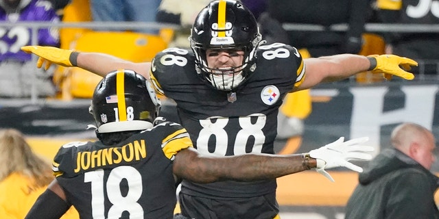 Pittsburgh Steelers tight end Pat Freiermuth (88) celebrates with wide receiver Diontae Johnson (18) after making a catch for a two-point conversion against the Baltimore Ravens during the second half of an NFL football game, Sunday, Dec. 5, 2021, in Pittsburgh.