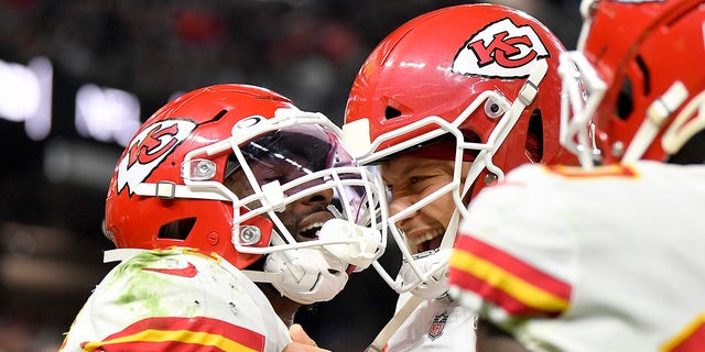 Darrel Williams celebrates with his Kansas City Chiefs teammate Patrick Mahomes after scoring a touchdown against the Raiders on Nov.14, 2021, in Las Vegas, Nevada.