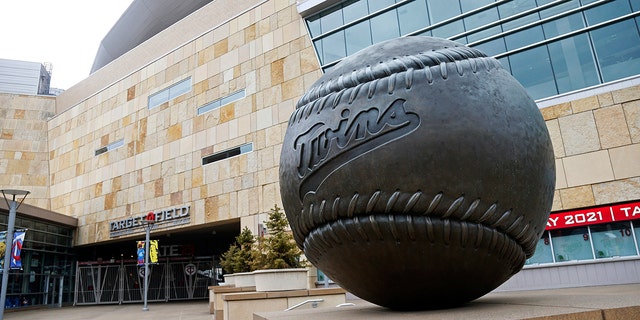 A giant baseball sculpture sits outside Target Field, home of the Minnesota Twins baseball team, Wednesday, March 25, 2020 in Minneapolis. Though the Twins would open on the road, the start of the regular season is indefinitely on hold because of the coronavirus pandemic. 