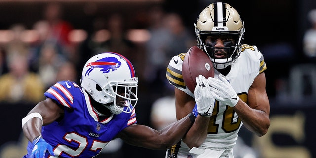 Buffalo Bills cornerback Tre'Davious White (27) defends a pass against New Orleans Saints wide receiver Tre'Quan Smith (10) in the first half of an NFL football game in New Orleans, Thursday, Nov. 25, 2021.