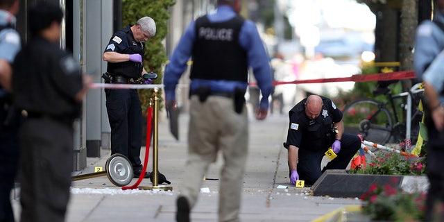 Chicago police investigate the shooting of rapper FBG Duck in the first block of East Oak Street in the Gold Coast neighborhood on Aug. 4, 2020. (Chris Sweda/Chicago Tribune/Tribune News Service via Getty Images)