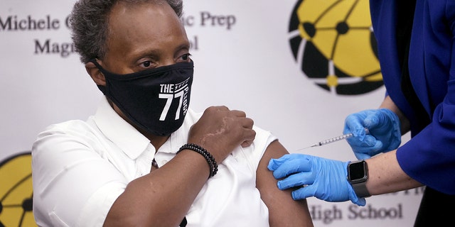 Chicago Mayor Lori Lightfoot gets a COVID-19 booster vaccine at Michele Clark High School on Nov. 12, 2021 in Chicago.
