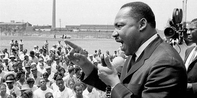 Dr. Martin Luther King Jr. speaks at a rally held at the Robert Taylor Houses in Chicago, Illinois, 1960s.