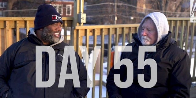 Pastor Paul Glyman with Pastor Corey Brooks on the 55th day of his 100-day rooftop vigil.