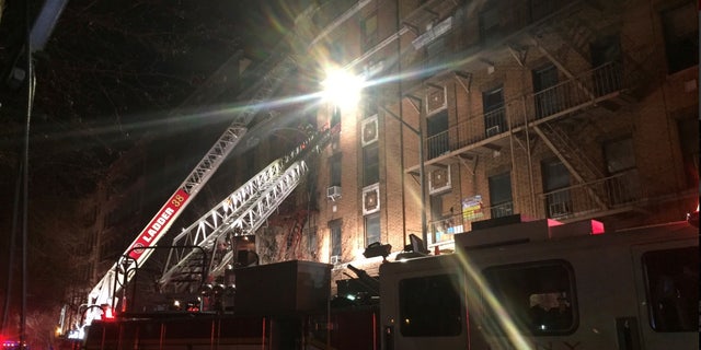 New York Fire Department ladder trucks deploy at a building fire in the Bronx borough of New York City, New York, U.S. December 28, 2017. (NYFD/Handout via REUTERS)