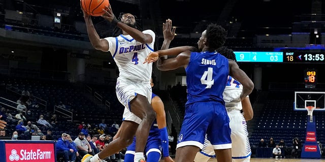DePaul's Javon Freeman-Liberty (4) drives to the basket past Seton Hall's Tyrese Samuel (4) during the first half of an NCAA college basketball game Thursday, Jan. 13, 2022, in Chicago.