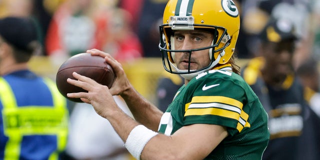 Green Bay Packers quarterback Aaron Rodgers warms up before an NFL football game against the Pittsburgh Steelers, Oct. 3, 2021, in Green Bay, Wisconsin.