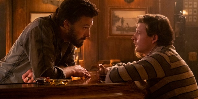 Ben Affleck, left, and Tye Sheridan in a scene from "The Tender Bar." 