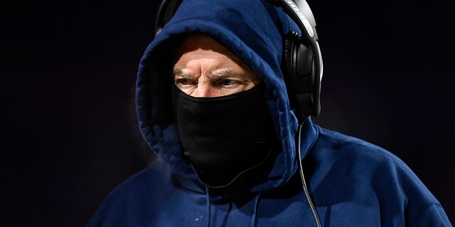 New England Patriots head coach Bill Belichick works the sidelines during the first half of an NFL wild-card playoff football game against the Buffalo Bills, Saturday, Jan. 15, 2022, in Orchard Park, N.Y.