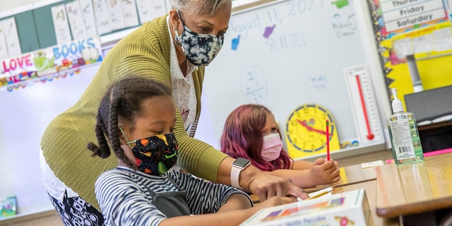 Joy Harrison instructs her second graders at Carl B. Munck Elementary School, in Oakland, California. (Santiago Mejia/San Francisco Chronicle via AP, Pool, File)