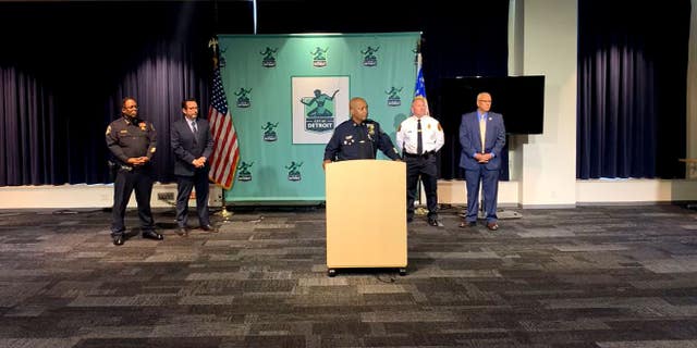 Detroit Police Chief James White and Farmington Hills Police Chief Jeff King speak about a case during a news conference 