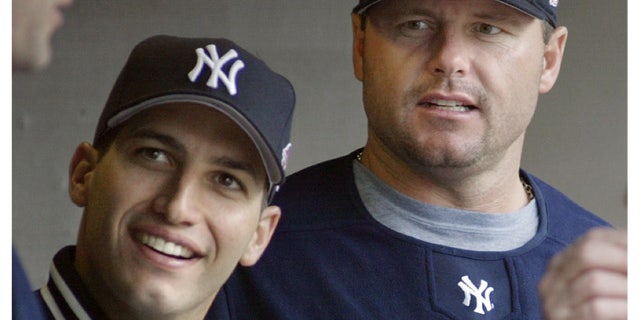 New York Yankees pitchers Andy Pettitte, left, and Roger Clemens talking with a teammate during a baseball game against the Detroit Tigers in Detroit.
