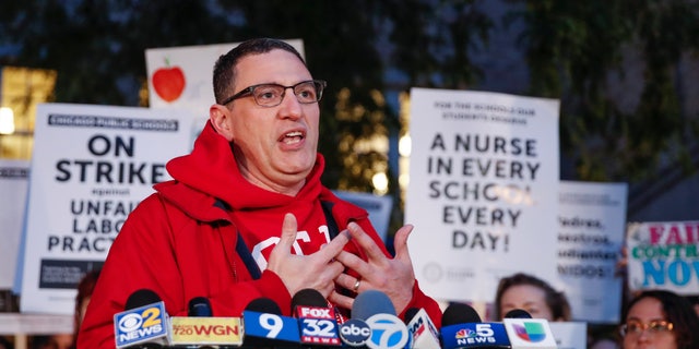 Chicago Teachers Union (CTU) President Jesse Sharkey speaks outside Peirce Elementary School on the first day of a strike by the CTU, on October 17 2019 in Chicago, Illinois. (Photo by Kamil Krzaczynski/ AFP) 