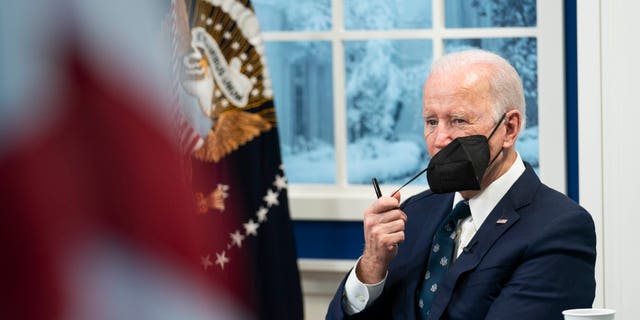 President Biden listens during a virtual meeting about reducing the costs of meat through increased competition in the meat processing industry in the South Court Auditorium at the Eisenhower Executive Office Building on Jan. 3, 2022, in Washington, D.C.