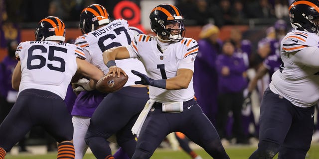 CHICAGO, ILLINOIS - DECEMBER 20: Justin Fields #1 of the Chicago Bears looks to pass against the Minnesota Vikings during the fourth quarter at Soldier Field on December 20, 2021 in Chicago, Illinois. 