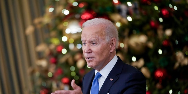 President Biden speaks about the omicron variant of the coronavirus in the State Dining Room of the White House, Dec. 21, 2021, in Washington, D.C. 