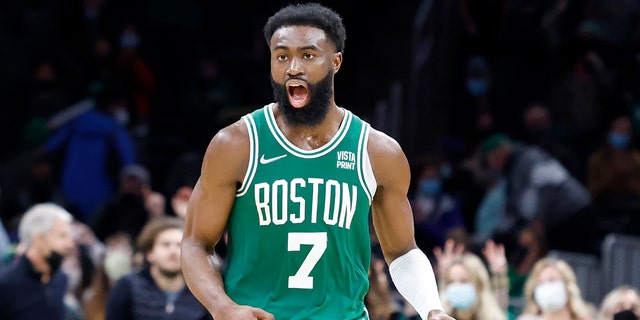 Boston Celtics guard Jaylen Brown (7) reacts during overtime of an NBA basketball game against the Orlando Magic, Sunday, Jan. 2, 2022, in Boston. 
