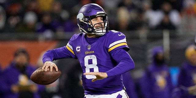 Minnesota Vikings quarterback Kirk Cousins passes during the first half of an NFL football game against the Chicago Bears Monday, Dec. 20, 2021, in Chicago.