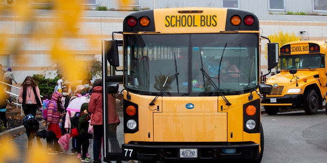 Students get onto buses in Portland, Maine. 