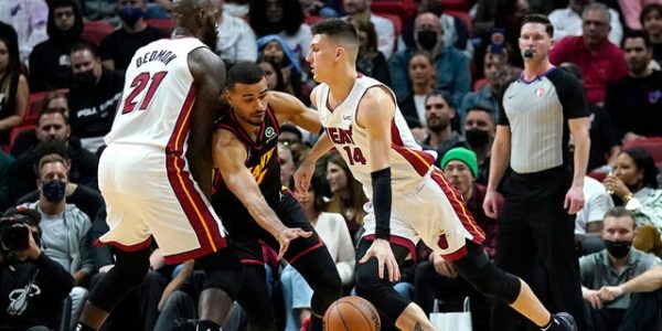 Heat rally late, scramble to get past Hawks in front of star-studded crowd
