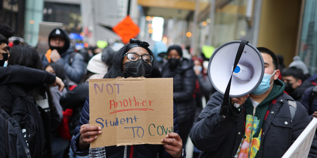 Public school students protest outside of the Chicago Public Schools headquarters after walking out of their classrooms on January 14, 2022 in Chicago, Illinois. (Photo by Scott Olson/Getty Images)