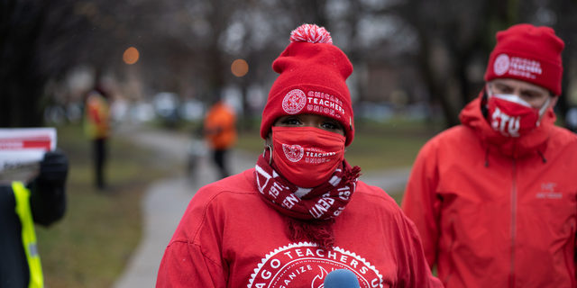Former teacher Tara Stamps speaks ahead of a car caravan where teachers and supporters gathered to demand a safe and equitable return to in-person learning during the COVID-19 pandemic in Chicago, IL on December 12, 2020. (Photo by Max Herman/NurPhoto via Getty Images)