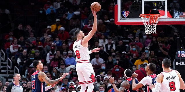 Chicago Bulls guard Zach LaVine (8) shoots against the Washington Wizards during the first half of an NBA basketball game in Chicago, Friday, Jan. 7, 2022.