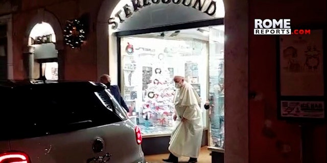In this image from video made available by Javier Martinez Brocal of Rome Reports, Pope Francis leaves a record shop in Rome, Tuesday, Jan. 11, 2022. 