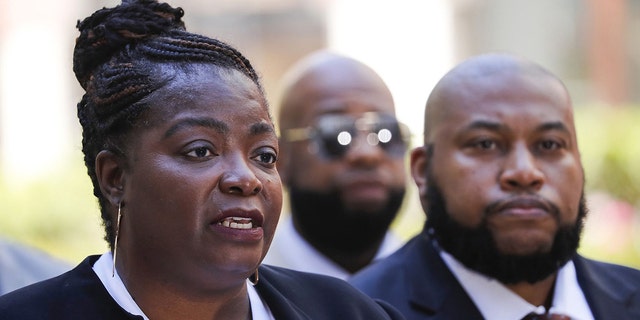 Anjanette Young, left, and attorney Keenan Saulter speak out in June on their efforts to resolve her case against the city of Chicago. That effort took six more months, with the City Council approving a settlement on Wednesday, Dec. 15, 2021.