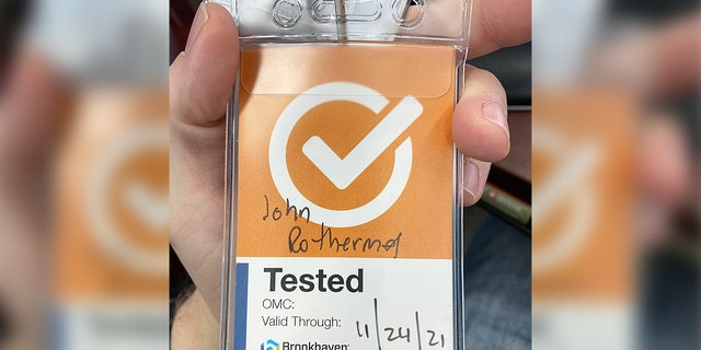 Orange badge that unvaccinated former Brookhaven engineer John Rothermel was told he should wear.