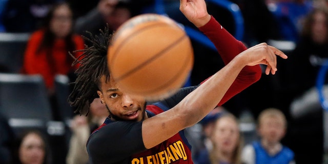 Cleveland Cavaliers guard Darius Garland passes the ball in the first half of an NBA basketball game against the Oklahoma City Thunder, Saturday, Jan. 15, 2022, in Oklahoma City.
