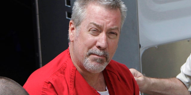 In this May 8, 2009, file photo, former Bolingbrook, Illinois, police officer Drew Peterson arrives for court in Joliet.