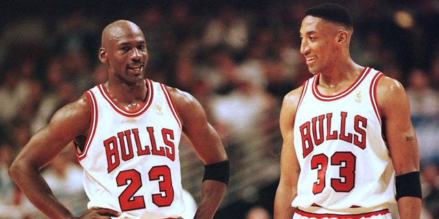 Michael Jordan (L) and Scottie Pippen (R) of the Chicago Bulls talk during the final minutes of their game 22 May in the NBA Eastern Conference finals aainst the Miami Heat at the United Center in Chicago, Illinois. The Bulls won the game 75-68 to lead the series 2-0.
