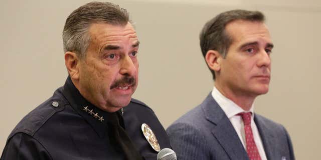FEb. 4, 2016: Los Angeles Police Chief Charlie Beck, left, and Los Angeles Mayor Eric Garcetti take questions about the bodies found at a park, during a news conference at LAPD headquarters in Los Angeles.