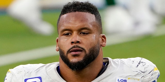 FILE - Los Angeles Rams defensive end Aaron Donald (99) walks off the field after a loss to the New York Jets in an NFL football game in Inglewood, Calif., in this Sunday, Dec. 20, 2020, file photo. A lawyer and his 26-year-old client told Pittsburgh police Wednesday, April 14, 2021, that Los Angeles Rams defensive lineman Aaron Donald and others assaulted the man at a nightclub last weekend, causing multiple injuries. (AP Photo/Jae C. Hong, File)