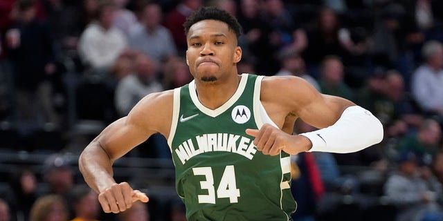 Milwaukee Bucks forward Giannis Antetokounmpo (34) runs up the court during the first half of a preseason game against the Utah Jazz Oct. 13, 2021, in Salt Lake City.