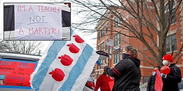 Supporters of the Chicago Teachers Union prepare for a car caravan on Jan. 30, 2021, during negotiations with Chicago Public Schools over a coronavirus safety plan agreement.