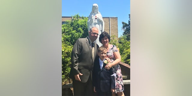 In this family photo snapped in 2019, Frank and Joan Thomas of Brooklyn, New York, celebrate their youngest son Joseph's First Holy Communion.