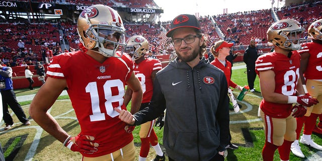 SANTA CLARA, CA - DECEMBER 23: Dante Pettis #18 and Run Game Coordinator Mike McDaniel of the San Francisco 49ers talk on the field prior to the game against the Chicago Bears at Levi's Stadium on December 23, 2018, in Santa Clara, California. The Bears defeated the 49ers 14-9.