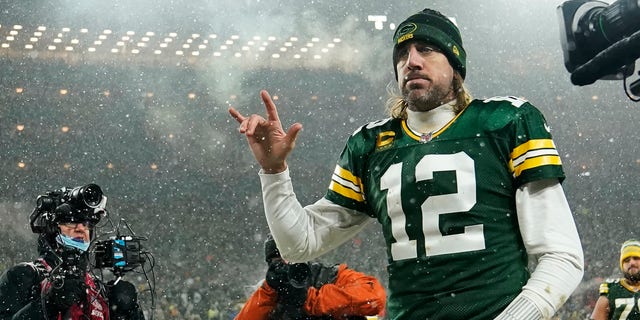 Quarterback Aaron Rodgers #12 of the Green Bay Packers gestures as he exits the field after losing the NFC Divisional Playoff game to the San Francisco 49ers at Lambeau Field on January 22, 2022 in Green Bay, Wisconsin. 