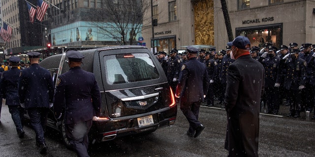 New York City mayor Eric Adams floors the Hearst carrying the body of police officer Jason Rivera after his funeral on January 28, 2022 along Fifth Avenue. (Photo by Andrew Lichtenstein/Corbis via Getty Images)