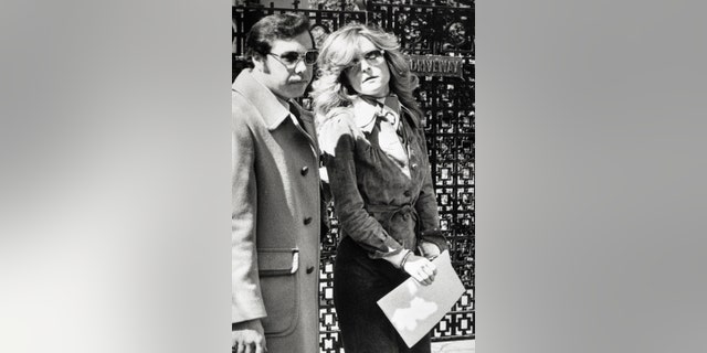 Bobbie Arnstein, Hugh Hefner's personal secretary, is led away in handcuffs by a federal agent after she was arrested on a drug charge in Chicago. Arnstein was arrested at the Playboy mansion and indicted for purchasing a pound of cocaine in Miami, in 1971, and bringing it to Chicago for sale.
